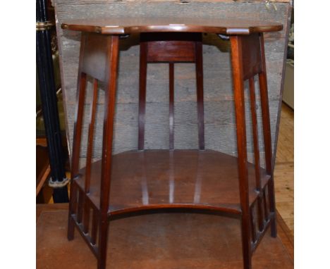 An Art Nouveau style mahogany two tier table, of shaped oval form, 63 cm wide 