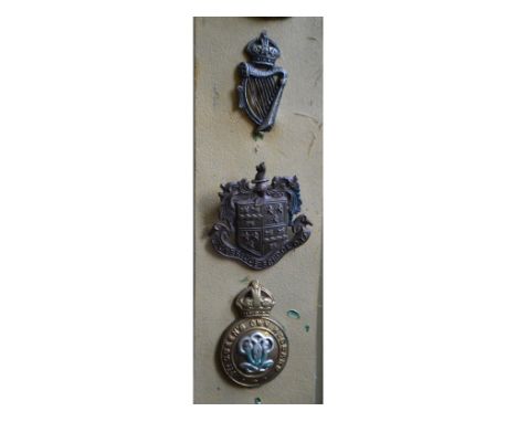 Twenty cap and collar badges, including Tonbridge School OTCReport by RBThe harp and crown badge measures 4 cm high x 2 cm wi