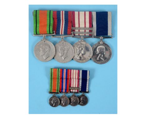 A group of four medals, awarded to Ply X. 3473 R T Newton CLR SGT RM, comprising a Defence Medal, a War Medal, a Naval Genera