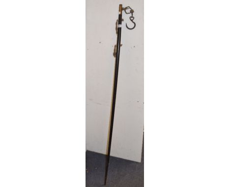 An Eastern ebonised measuring stick, 154 cm high 