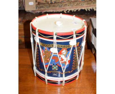A regimental Scots Guards ice bucket, in the form of a drum, 21 cm diameter, two trays, a lantern, and a candlestick (5) 