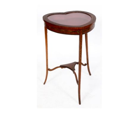 A late Victorian table vitrine, in the form of a heart, veneered in satinwood and with painted floral decoration, on tapering