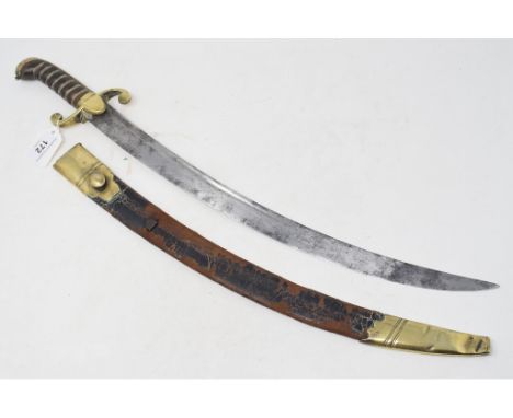 A 19th century short sword, with a curved blade, and a brass mounted scabbard, worn and with some loss 