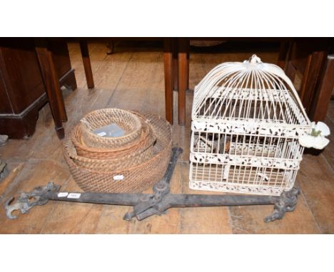 A painted metal bird cage, with two carved wood painted birds, 36 cm wide, hanging scales, baskets and place markers (qty) 
