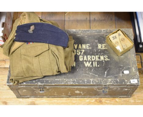 A battledress jacket, trousers, and other items, in a tin trunk Capt DS Vane REReport by GHThe jacket is stencilled P above W