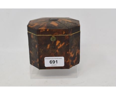 A late 18th/early 19th century tortoiseshell tea caddy, of shaped octagonal form, 9 cm high 