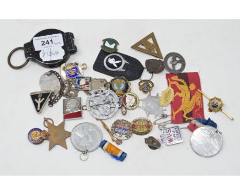 A compass, assorted military and other badges including Canadian.Report by GHThe Toronto Regiment badge: chips to blue enamel