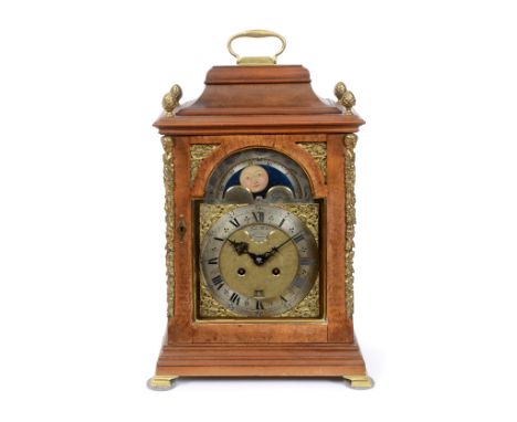 An 18th century style walnut bracket clock, the arched square bras dial with a silvered chapter ring, a phases of the moon di