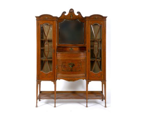 A late Victorian satinwood display cabinet, painted a classical bust, vases of flowers, scrolling acanthus leaves, floral swa