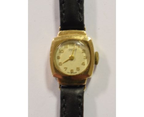 A lady's 9ct gold Centaur wristwatch, a brass ship's bulkhead style clock, 19 cm diameter, a brass carriage timepiece, 14 cm 