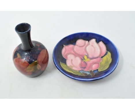 A Moorcroft Pottery Pomegranate vase, 9 cm high, a similar Magnolia pin dish, a silver goblet, a Steiff mouse, a Lalique fish