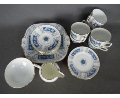 A Coalport Revelry tea service comprising six cups and saucers, six side plates, sugar bowl, milk jug and cake plate, 21 piec