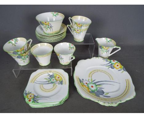 An Art Deco tea service by Bell China, of conical form, decorated with floral sprays comprising six cups and saucers, six tea