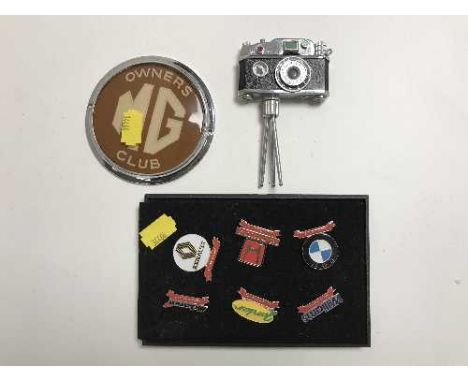 An MG owner's badge, collector's enamelled badges, novelty lighter in the form of a camera 