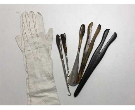 A pair of Victorian lady's calf skin leather gloves, two pairs of glove stretchers, three tortoiseshell handled button hooks.