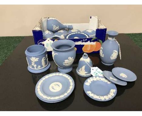 A collection of twenty one pieces of Wedgwood  blue and white Jasperware comprising three vases, two bells, a lidded jar, thr