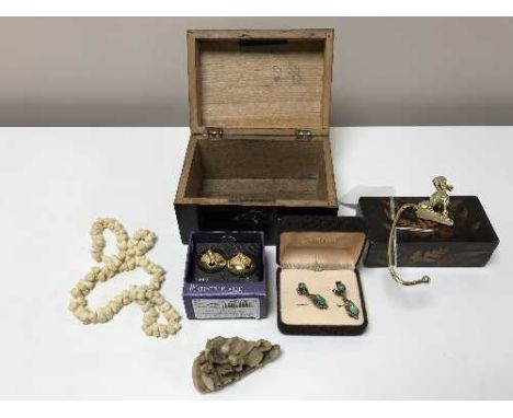 A jewellery box containing a pair of earrings, carved necklace, carving, pair of boxed Jade earrings, miniature thread box.