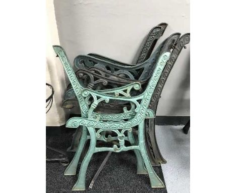 Four pairs of metal garden bench ends 