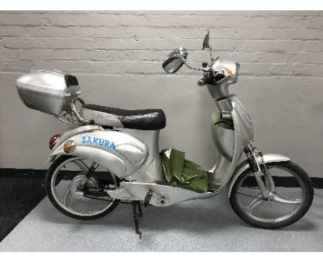 A Sakura scooter with key and charger 