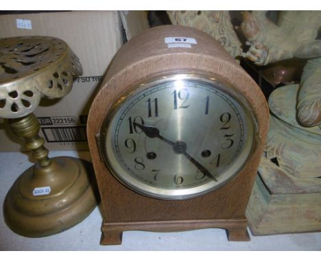 AN OAK MANTLE CLOCK