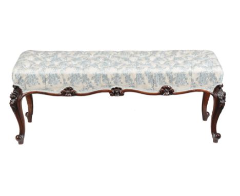  A Victorian carved walnut stool,   circa 1870, the button upholstered seat above a moulded frieze and tapering cabriole legs
