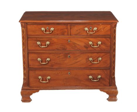  A George III mahogany and chequer strung chest of drawers,   circa 1780, the moulded rectangular top above two short and thr
