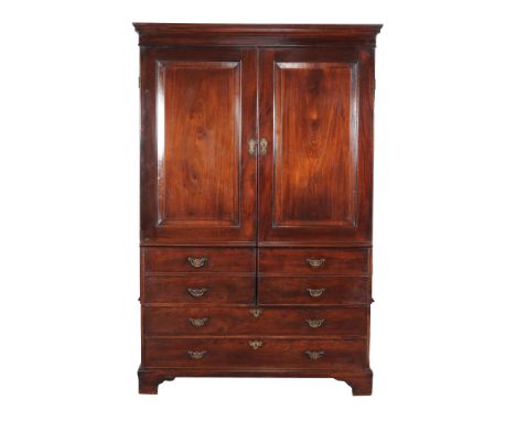  A George II mahogany clothes press,   circa 1750, the moulded cornice above a pair of panelled doors incorporating four fals