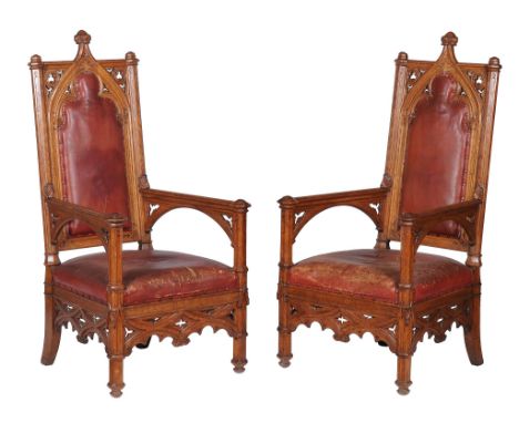  A pair of Victorian oak armchairs in Gothic Revival style  , circa 1850, each carved and moulded frame incorporating lancet,