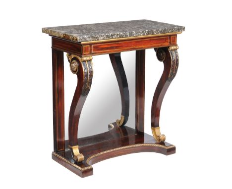 Ω A Regency rosewood, brass inlaid and parcel gilt console table, circa 1815, the fossilised marble top above the brass strun