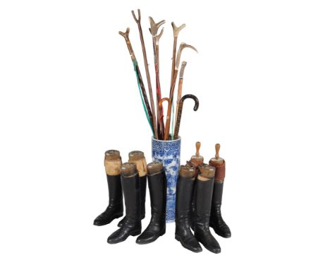 A Chinese blue and white ceramic umbrella spill, 20th century, containing seven thumbsticks and two walking sticks; together 