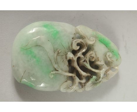 A CARVED JADE PENDANT 3.5ins X 2ins