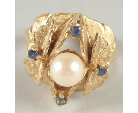 A 14CT GOLD PEARL AND SAPPHIRE LEAF RING.