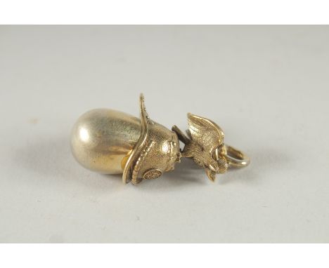 A RUSSIAN SILVER EGG AND HELMET PENDANT.