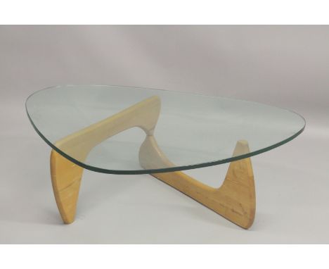 A VITRA NOGUCHI BOOMERANG STYLE COFFEE TABLE with light oak supports.