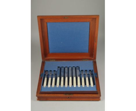 A SET OF 12 DESSERT KNIVES AND FORKS with mother of pearl handles in a mahogany canteen. Sheffield 1930.