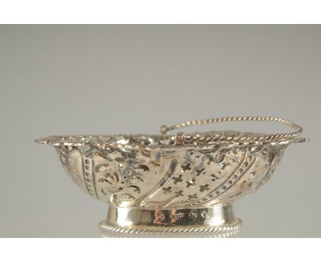 A GEORGE III PIERCED SILVER BON BON BASKET with swing handles. London 1771.  Maker: A. R. P.