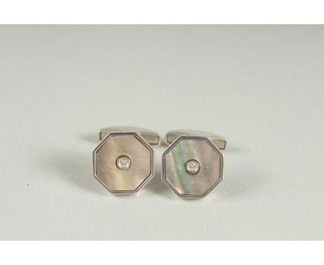 A PAIR OF STERLING SILVER MOTHER OF PEARL AND DIAMOND CUFF LINKS.