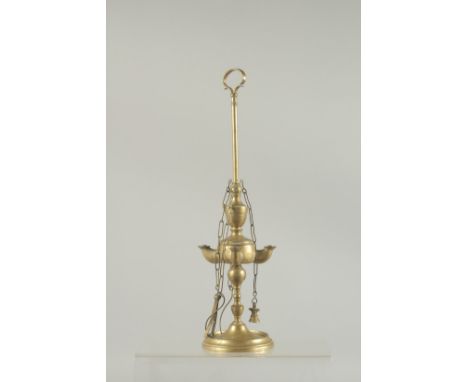 A BRASS STANDING OIL LAMP. 12ins high.