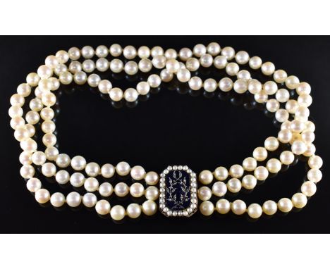 A triple strand of cultured pearls with a rose gold clasp set with blue guilloché enamel mounted with a foliate design and se