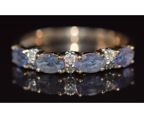 A 9ct gold ring set with tanzanites and diamonds, 1.6g, size P