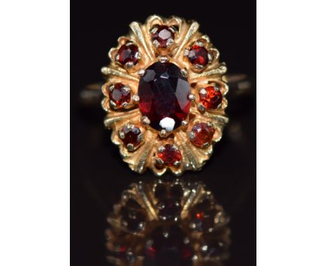 A 9ct gold ring set with garnets, 3.5g, size N
