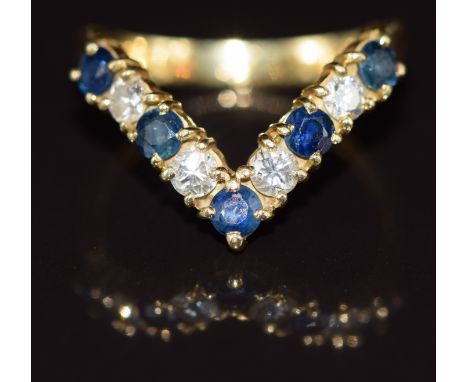 An 18ct gold V shape ring set with sapphires and diamonds, 3.6g, size M