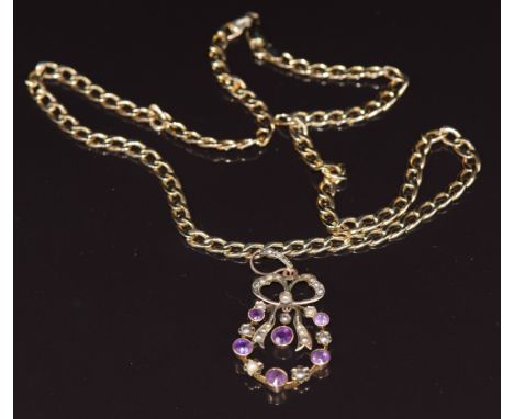 Edwardian 9ct gold pendant set with amethysts and seed pearls in a bow design and a 9ct gold curb link necklace/ chain, 6.6g&