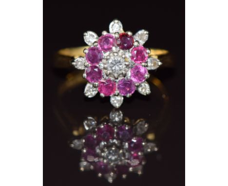 An 18ct gold ring set with diamonds and rubies in a cluster, 5.7g, size Q
