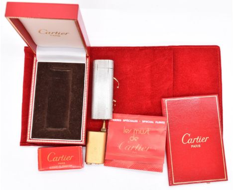 Cartier silver plated engine turned lighter, in original fitted box with certificate and pouch