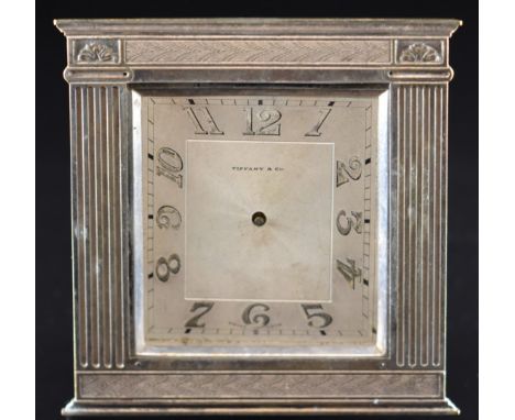 Tiffany &amp; Co. travelling or desk clock, the ornate frame flanked by fluted columns, with easel back, the movement marked 