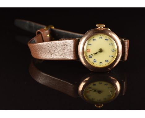 Unnamed 9ct gold ladies wristwatch with blued hands, blue Arabic numerals, gilt decorated white enamel dial and unsigned move