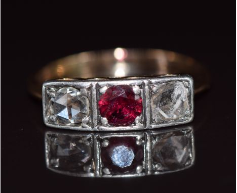 Victorian gold and silver ring set with a ruby of approximately 0.43ct and two rose cut diamonds, 3g, size S