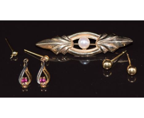 A 9ct gold brooch set with a pearl, a pair of&nbsp;9ct gold earrings set with a ruby to each and a further pair of earrings, 