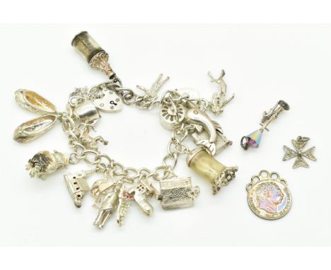 Silver charm bracelet with nineteen charms including message in a bottle, wise owl, tea pot, clock, etc&nbsp;